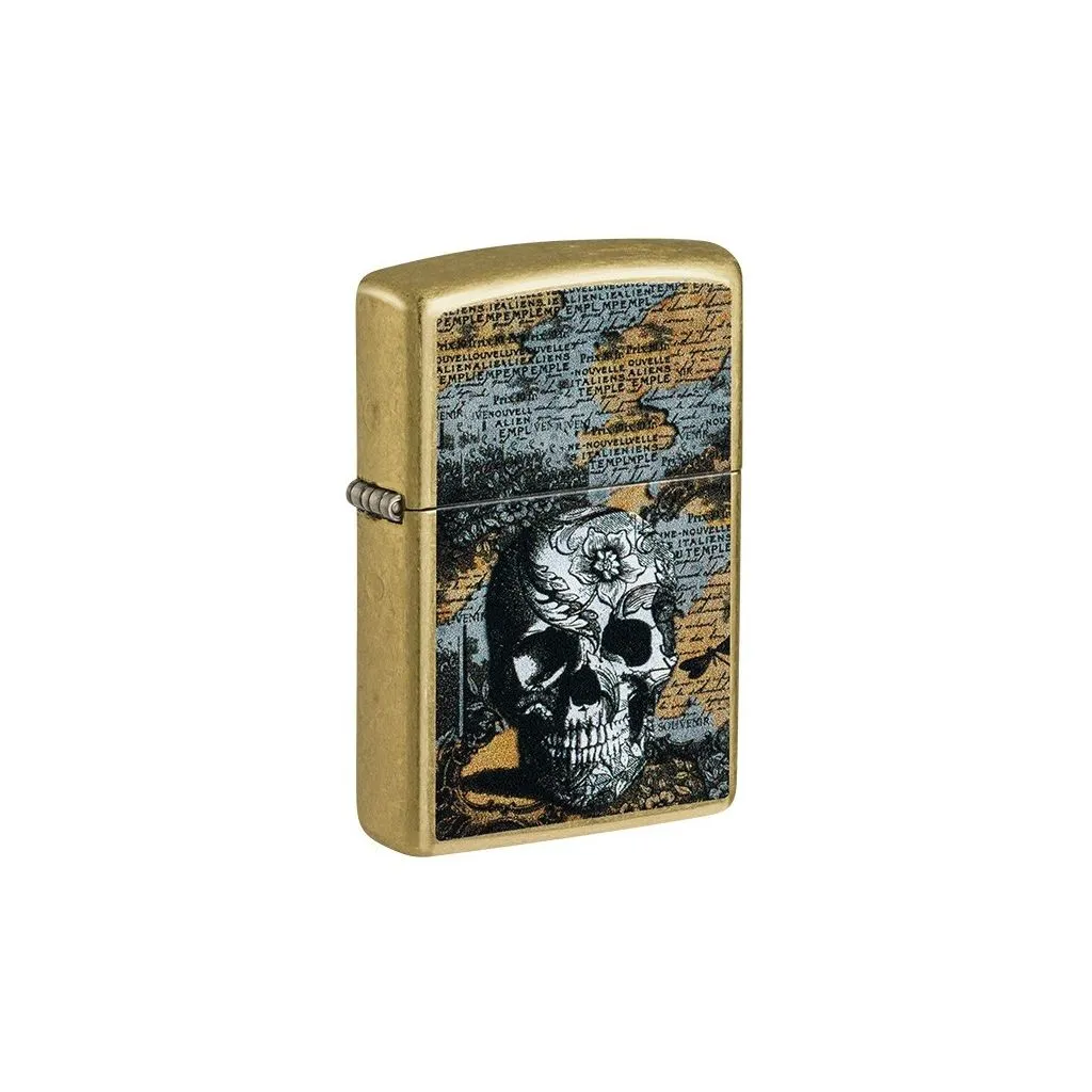 Zippo lighter med floral skull-motiv på metalkorpus.